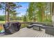 Enjoy outdoor living with this deck featuring a grill, outdoor seating, and a view of the golf course at 204 Bellerive Ln, Summerville, SC 29483