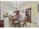 Dining room with dining table and chairs set in front of elegant wooden cabinets at 204 Bellerive Ln, Summerville, SC 29483
