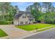 Well-maintained home with a two-car garage, a large lawn, and mature trees at 204 Bellerive Ln, Summerville, SC 29483