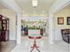 Elegant foyer with marble floors, decorative table, and an open view to the living spaces at 204 Bellerive Ln, Summerville, SC 29483