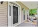 Welcoming front porch featuring a decorative rug, seating, and a beautifully decorated door at 204 Bellerive Ln, Summerville, SC 29483