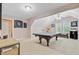 Spacious game room featuring a pool table, carpet, and two windows for natural light at 204 Bellerive Ln, Summerville, SC 29483