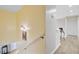 Upstairs hallway boasting hardwood floors and providing seamless transition to different rooms at 204 Bellerive Ln, Summerville, SC 29483