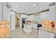 Bright kitchen features custom cabinets, light countertops, an island with cooktop, and modern appliances at 204 Bellerive Ln, Summerville, SC 29483