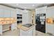 Modern kitchen offers stainless steel appliances, wood-style flooring, and granite countertops on the center island at 204 Bellerive Ln, Summerville, SC 29483