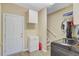 Spacious laundry area with neutral walls, white cabinets, and modern appliances at 204 Bellerive Ln, Summerville, SC 29483