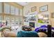 Inviting living room featuring a fireplace, built-in shelving, and abundant natural light at 204 Bellerive Ln, Summerville, SC 29483