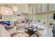 Spacious living room with a large sofa, coffee table, and access to the outdoor area at 204 Bellerive Ln, Summerville, SC 29483