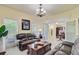 Living room with dual sofas, coffee table with a chessboard, and interior view to other rooms at 204 Bellerive Ln, Summerville, SC 29483