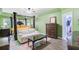 The main bedroom has green walls, a sitting area, ceiling fan, and ensuite bath with a closet at 204 Bellerive Ln, Summerville, SC 29483