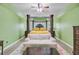 Spacious main bedroom with decorative bed frame, sitting area, and green walls at 204 Bellerive Ln, Summerville, SC 29483