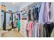 Spacious walk-in closet with custom shelving, drawers, and ample hanging space for clothes and accessories at 204 Bellerive Ln, Summerville, SC 29483