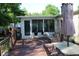Nice back porch area with chairs and table, with a small building and lots of trees at 204 Pete Ewers Dr, Summerville, SC 29483