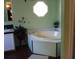 Charming bathroom featuring a large soaking tub beneath an octagon window at 204 Pete Ewers Dr, Summerville, SC 29483