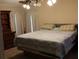 Comfortable bedroom with a large bed, dresser, and neutral decor at 204 Pete Ewers Dr, Summerville, SC 29483