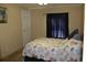 Cozy bedroom with a patterned bedspread, natural light, and a relaxing atmosphere, perfect for a restful night at 204 Pete Ewers Dr, Summerville, SC 29483