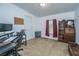 Bedroom with desk, vintage cabinet, and neutral carpet at 204 Pete Ewers Dr, Summerville, SC 29483
