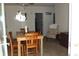Cozy dining area with wood table set, and ample natural light; inviting space for meals at 204 Pete Ewers Dr, Summerville, SC 29483