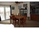 Open dining area with wooden table, seating for six, and access to the outdoors through sliding glass doors at 204 Pete Ewers Dr, Summerville, SC 29483