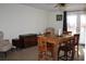 Inviting dining room with a wooden table, seating for six, and natural light creating a warm and welcoming atmosphere at 204 Pete Ewers Dr, Summerville, SC 29483