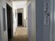 Bright hallway featuring white walls and multiple doorways at 204 Pete Ewers Dr, Summerville, SC 29483