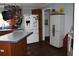 Bright kitchen with stainless steel appliances, a wooden island, and ample storage space in wood and white cabinets at 204 Pete Ewers Dr, Summerville, SC 29483