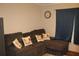 Comfortable living room features a brown sectional sofa with decorative pillows and a warm, inviting atmosphere at 204 Pete Ewers Dr, Summerville, SC 29483