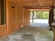 Spacious carport with wood walls and posts offers ample parking and protection from the elements at 209 Jungle Rd, Edisto Beach, SC 29438