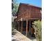 Exterior of multi-level wooden building features a wrap-around porch and wood facade at 209 Jungle Rd, Edisto Beach, SC 29438