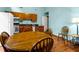 Eat-in kitchen with dining area, light-blue walls, oak table and cabinets, and granite countertop at 209 Jungle Rd, Edisto Beach, SC 29438