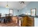 Open-concept living area with kitchen, dining, and comfortable seating area at 209 Jungle Rd, Edisto Beach, SC 29438