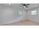 Spacious bedroom with ample natural light from two windows and a ceiling fan at 2135 Clayton St, Charleston, SC 29414