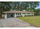 Charming single story house with manicured lawn and updated facade at 2135 Clayton St, Charleston, SC 29414