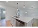 Kitchen island featuring a stainless steel dishwasher, sink and a view to the living area at 2135 Clayton St, Charleston, SC 29414