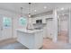 Bright kitchen featuring a center island, white cabinets, and modern appliances at 2135 Clayton St, Charleston, SC 29414