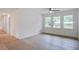 Bright living room with a view of neighboring houses and large windows at 2135 Clayton St, Charleston, SC 29414
