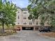 Exterior view of the building with drive-through and mature trees in a well-maintained setting at 2244 Ashley Crossing Dr # 534, Charleston, SC 29414