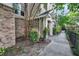 Well-maintained building exterior with brick accents and lush landscaping enhances curb appeal at 2244 Ashley Crossing Dr # 534, Charleston, SC 29414