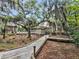 Scenic community path winds through mature trees and lush landscaping leading to community amenities at 2244 Ashley Crossing Dr # 534, Charleston, SC 29414