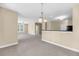 Spacious living room with carpet and open concept to the kitchen and dining area at 2244 Ashley Crossing Dr # 534, Charleston, SC 29414
