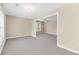 Large carpeted living room with beige walls, connected bonus area, and abundant natural light at 2244 Ashley Crossing Dr # 534, Charleston, SC 29414
