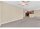 Open-concept living area with carpet and view to the kitchen through breakfast bar at 2244 Ashley Crossing Dr # 534, Charleston, SC 29414