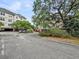 Convenient parking area surrounded by lush greenery and trees for a serene environment at 2244 Ashley Crossing Dr # 534, Charleston, SC 29414