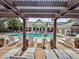 Inviting poolside lounge with pergola, chairs, and lush landscaping perfect for relaxation and leisure at 2244 Ashley Crossing Dr # 534, Charleston, SC 29414