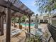 Comfortable poolside seating under a pergola provides shade and views of the beautiful community pool at 2244 Ashley Crossing Dr # 534, Charleston, SC 29414