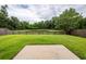 Backyard has a well manicured lawn, gated access, and a scenic view of the pond at 228 Donatella Dr, Goose Creek, SC 29445