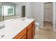 Bathroom featuring double sink vanity, a mirror, and a walk-in closet at 228 Donatella Dr, Goose Creek, SC 29445
