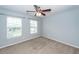 Bright bedroom offers neutral walls, carpet, and double windows at 228 Donatella Dr, Goose Creek, SC 29445