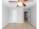 Neutral bedroom with plush carpet, a ceiling fan, and a doorway to another room at 228 Donatella Dr, Goose Creek, SC 29445