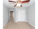 Neutral bedroom with plush carpet, a ceiling fan, and double door closet at 228 Donatella Dr, Goose Creek, SC 29445